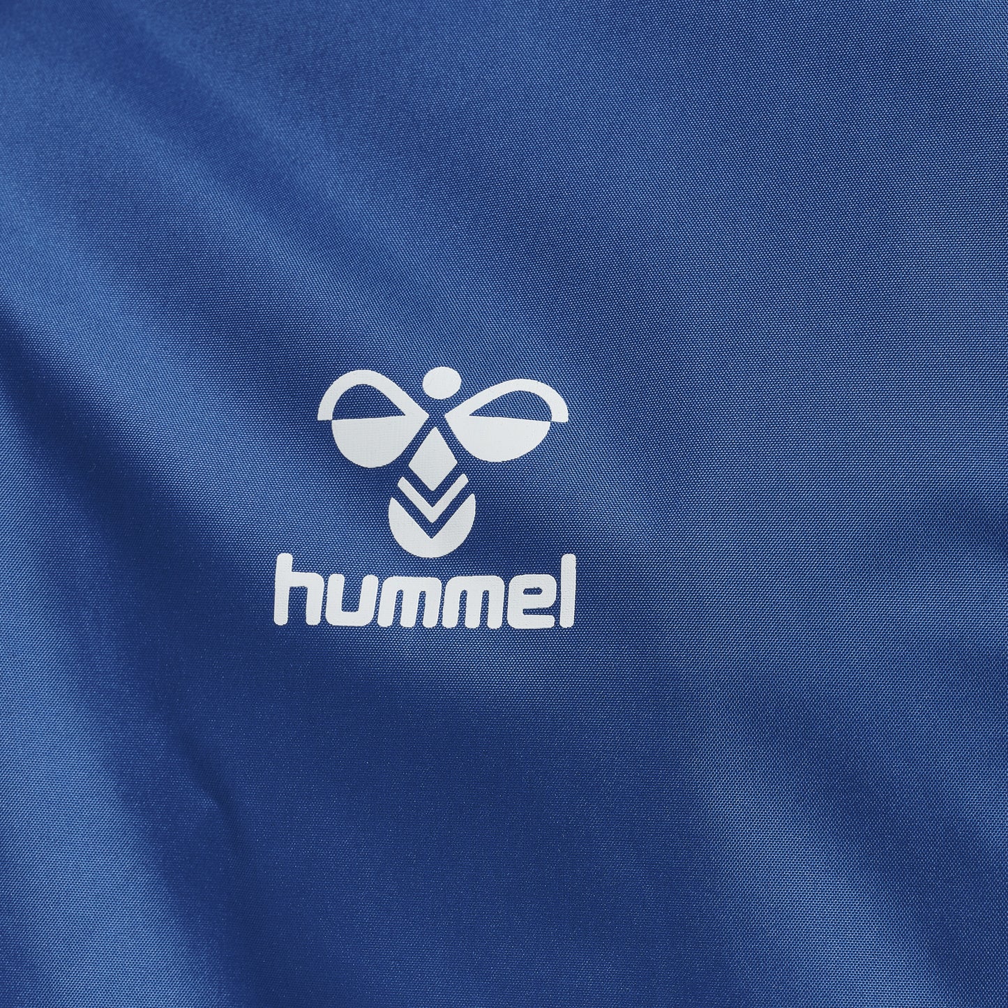 hmlCORE XK SPRAY JACKET KIDS TRUE BLUE